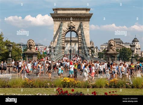 Crowds Of People Crossing The Szechenyi Chain Bridge On St Stephen S