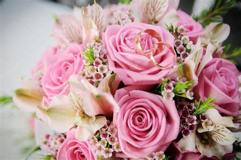 Discover the perfect diamond engagement rings & wedding rings for him and her at tiffany & co. Wedding bridal bouquet of roses. Wedding rings lying on a ...