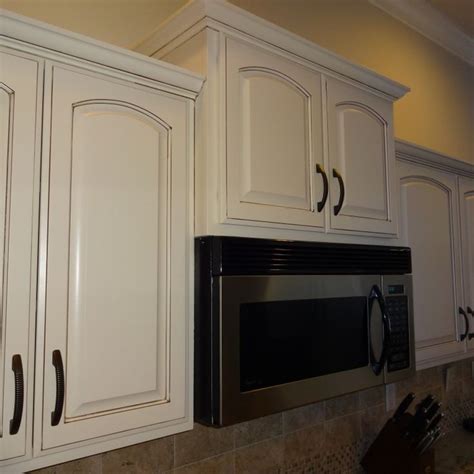 View interior and exterior paint colors and color palettes. Refinished Kitchen Cabinets Dover White with brown glaze ...