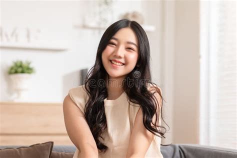 Stunning Beautiful Attractive Asian Young Woman Sit On Couch Or Sofa