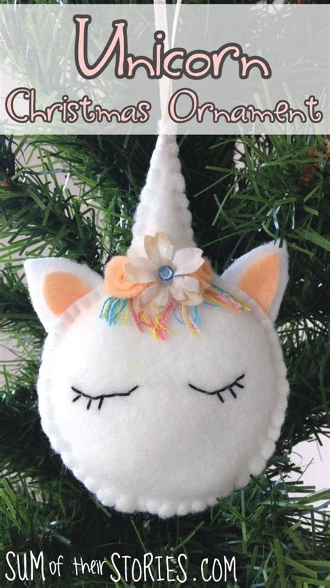 A Stuffed Unicorn Ornament Hanging From A Christmas Tree With Text
