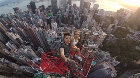 Video Russian Couple’s Daredevil Selfies Atop Hong Kong’s Highest Crane Are Breathtaking
