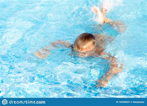 Child Learn To Swim Dive In Blue Pool With Fun Jumping Deep Down
