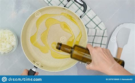 Chef Pouring Olive Oil From Bottle Into Frying Pan Close Up Cooking