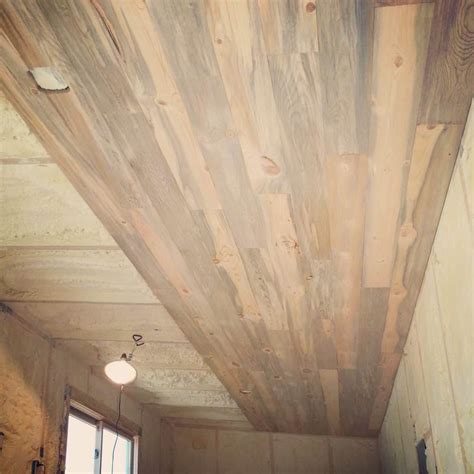 Build faux heart pine beams to run across the ceiling. Beautiful blue stain beetle-kill pine ceiling and walls ...