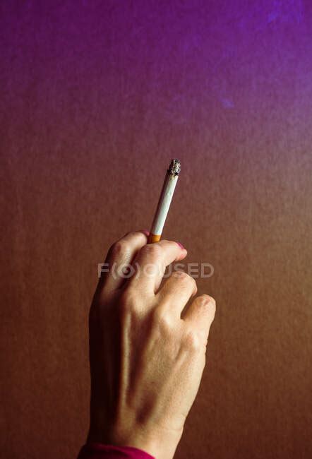 A Womans Hand With A Lit Cigarette Campaign To Prevent Smoking