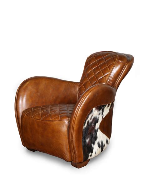 Search all products, brands and retailers of cowhide chairs: Saddle Brown Leather Cowhide Occasional Chair with Stool
