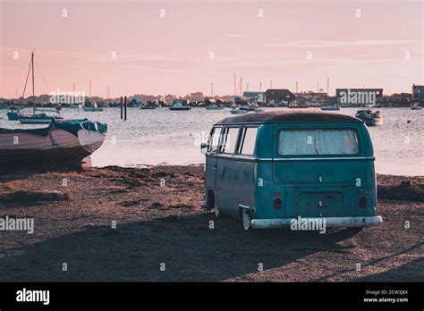 A Vintage Camper Van Parked Near The Sea At Sunset Stock Photo Alamy