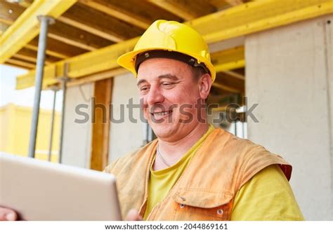 Smiling Construction Worker Foreman During Construction Stock Photo