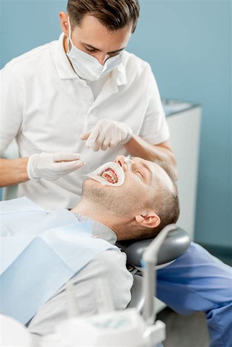 Patient With Dental Braces During A Regular Orthodontic Visit Stock