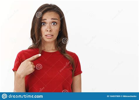 Embarrassed Insecure Cute Brunette Woman In Red T Shirt Look Concerned