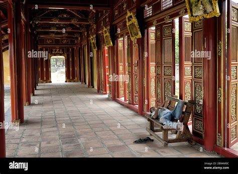 Man Taking A Nap On A Bench At The Imperial City Of Hue Vietnam Stock