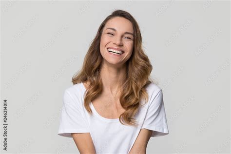 Happy Cheerful Young Woman With Beautiful Face Teeth And Hair Laughing