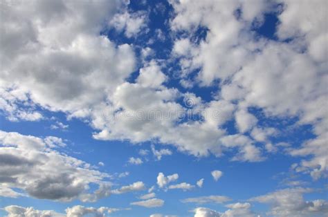 A Blue Cloudy Sky With Many Small Clouds Blocking The Su Stock Image