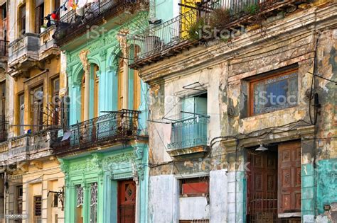 Colorful Dilapidated Building Facades With Balconies In Havana Habana