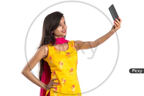 Image Of Beautiful Indian Girl Taking Selfie In Smart Phone Hf062115 Picxy