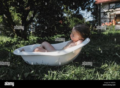 Little Girl Relaxing In Bath Tub In Garden Stock Photo Alamy