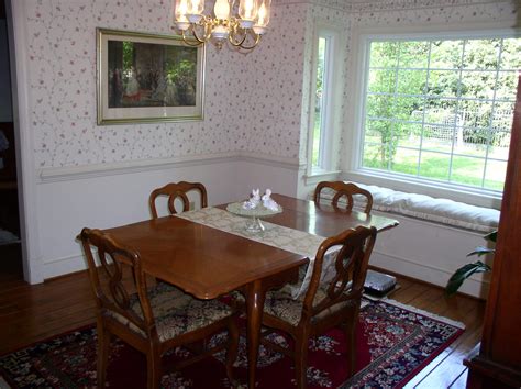 I really love how the curtains hung outside the window frame the couch and make the room feel tall and airy. Need help with window treatments for bay/box window with ...