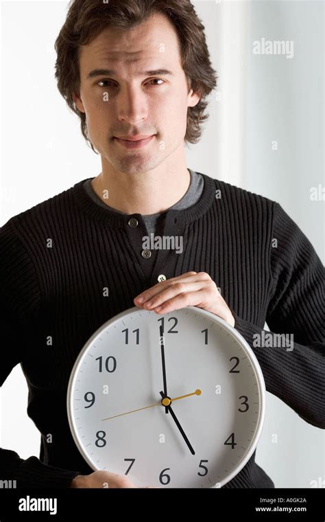 Closeup Of Man With Clock Stock Photo Alamy