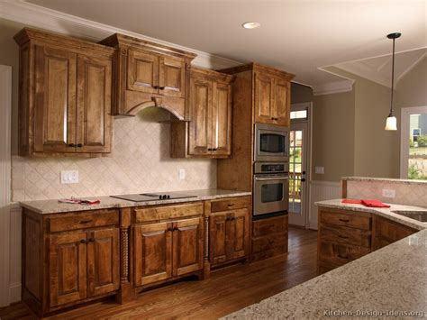 It all goes down in the 312. Pictures of Kitchens - Traditional - Medium Wood Cabinets, Golden Brown