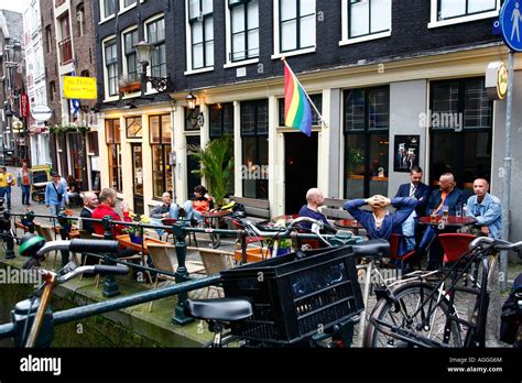 Men Sitting Outside A Gay Bar On The Red Light District Amsterdam Stock