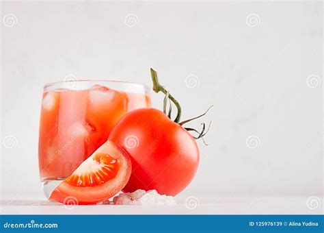 Fresh Cold Red Tomato Drink And Pulpy Tomato With Piece Salt On Light