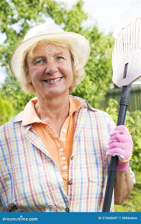 Portrait Of A Smiling Senior Woman In Garden Stock Image Image Of