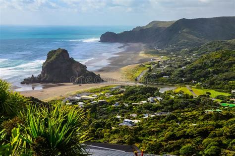 Piha Beach View From Lookout With Blue Sky With White Clouds Above