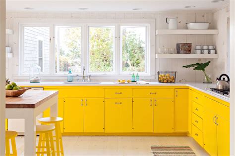 This is a modern kitchen design with basic wengue kitchen cabinets topped with white solid surface. 30 Beautiful Yellow Kitchen Ideas