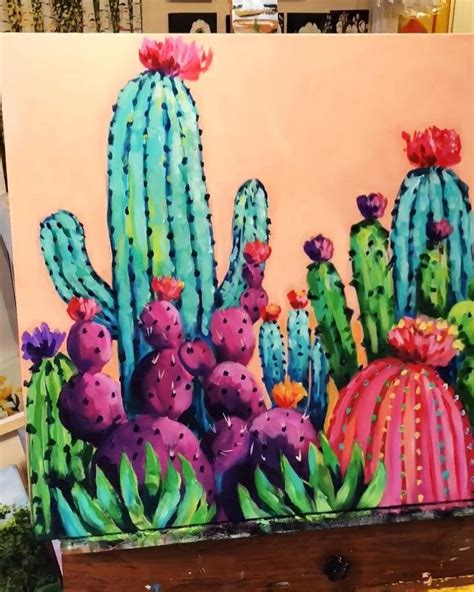 A Painting Of Cactuses Painted On An Easel