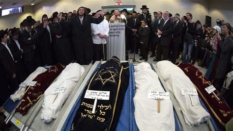 Ultra Orthodox Jews Cry As A Prayer Is Said At The Close Of A Funeral