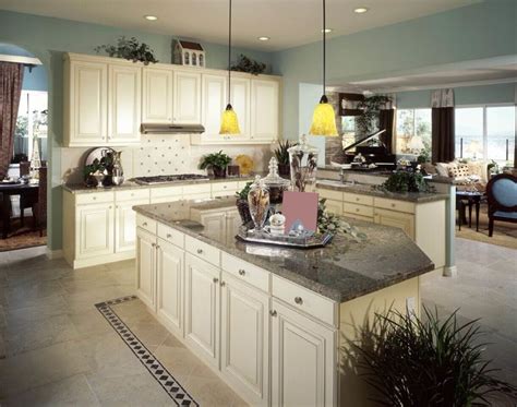 It stands up well against daily wear opposite the white shaker cabinets is a large center island with dark brown flat panel cabinets and a white countertop. 36 Inspiring Kitchens with White Cabinets and Dark Granite ...