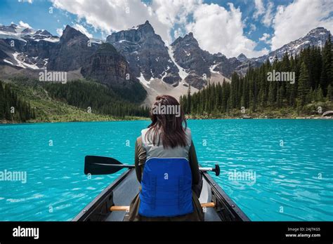 Tourist Canoeing On Moraine Lake During Summer In Banff National Park