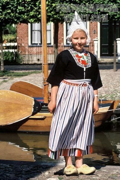 A Dutch Girl With Traditional Costume The Strips Of The Dress Are Also