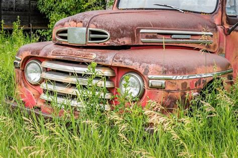 Premium Photo Abandoned Classic Red Pickup Truck In The Tall Grass On
