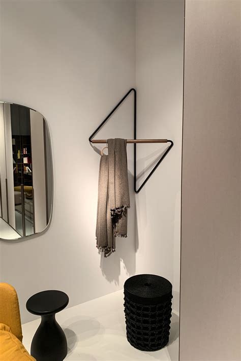 Plywood clothes rack with a shoe stand and enclosed storage cabinets. This Clothing Rack Was Designed To Fit Into Corners
