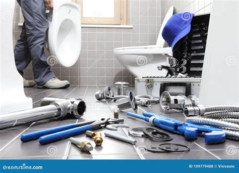 Hands Plumber At Work In A Bathroom Plumbing Repair Service As Stock