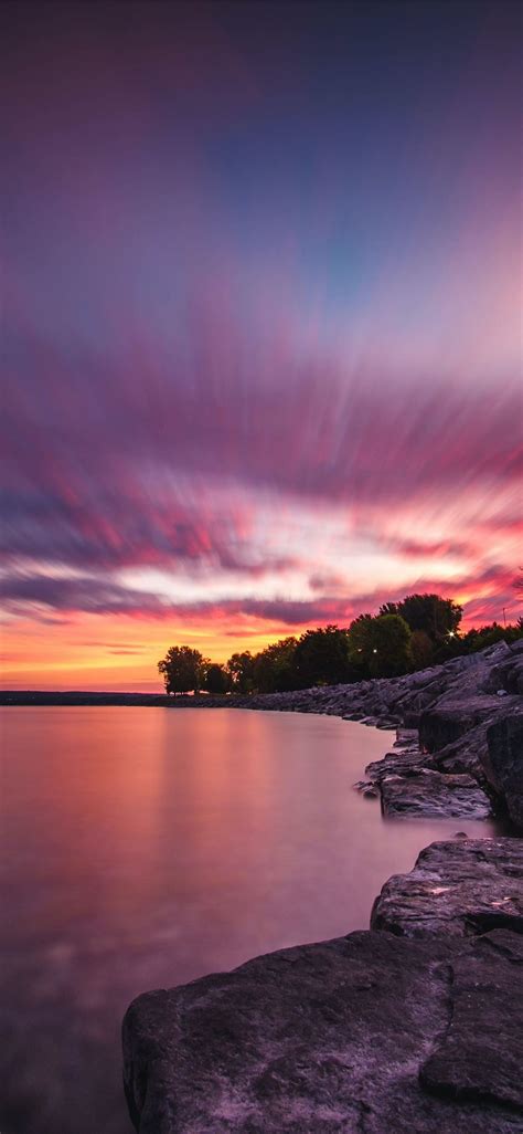 Body Of Water And Gray Rock Formation Sunset Sky Nature Water