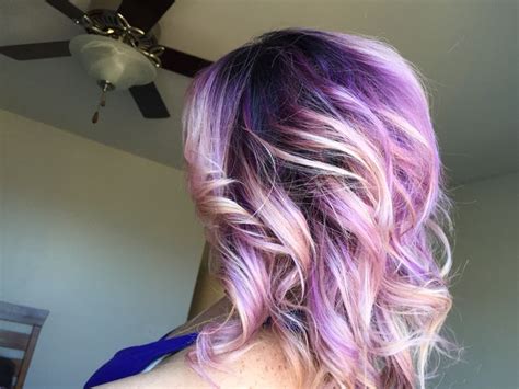 Pink champagne makes a romantic hair color, which radiates a playful impression. Purple ombré hair. Dark roots with light purple pink ends ...