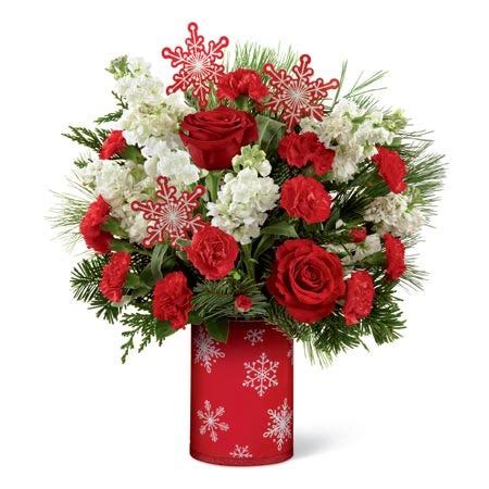 The choice to send christmas flowers arrangements to ireland is roses, lilies, holly, ivy, mistletoe, and gypsophila. Snowy Christmas Morning Bouquet at Send Flowers