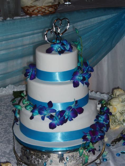 Three tier wedding cake in royal blue and white. SugarBakers Cake Design: Blue Orchid Wedding Cake