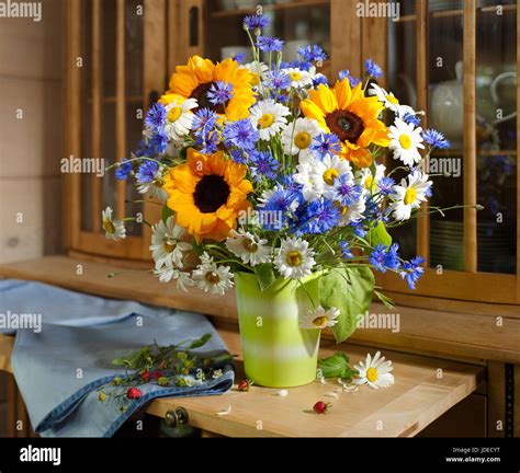 Bouquet Of Flowers With Sunflowers Cornflowers And Daisies Stock Photo