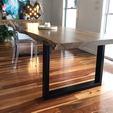 Hoop / box square metal table legs. A natural edge dining table with steel legs