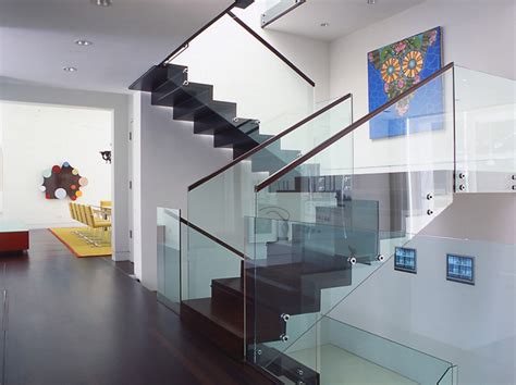 Lighting devices can be easily placed along the edge of the wall. 22 Sleek Glass Railings for the Stairs | Home Design Lover