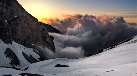 Download Wallpaper Sunset Snow Mountains Super Landscape 1600x900