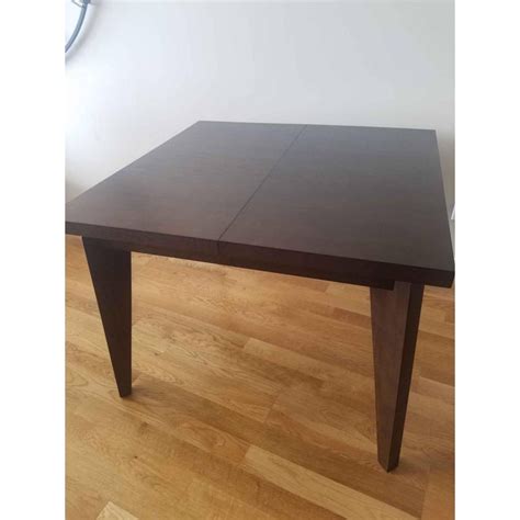 Expandable dining tables come in a variety of sizes and styles, many with internal hidden extensions that lengthen the furnishing so it can seat 6, 10 or more with a few easy maneuvers. West Elm Anderson Solid Wood Expandable Table | Chairish