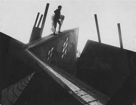 Caligari francis (friedrich feher) and an older man are sitting in a garden, telling stories. THE CABINET OF DR. CALIGARI - Cinema For All