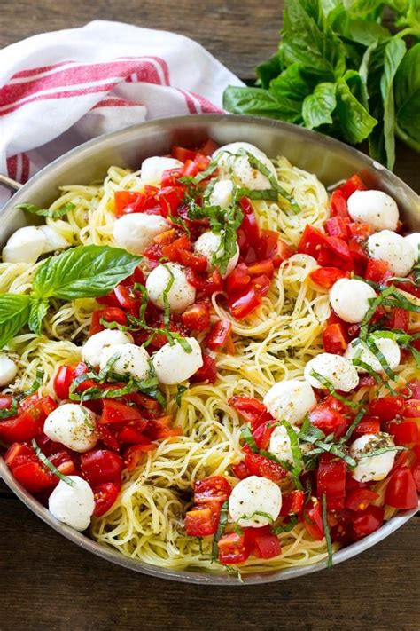 Into a large pot or deep saute pan, add olive oil (2 tablespoon) and the garlic (4 clove) and cook for a few minutes until fragrant. A pan of angel hair caprese pasta topped with olive oil ...