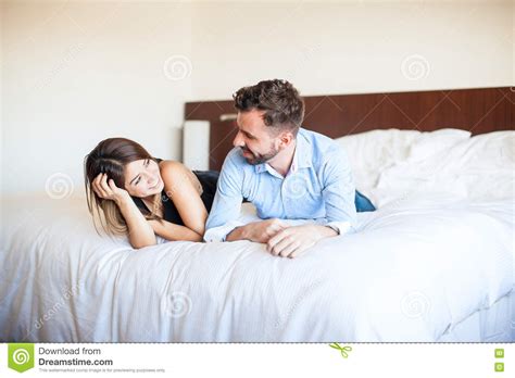 Couple Relaxing On A Bed Together Stock Image Image Of Hispanic