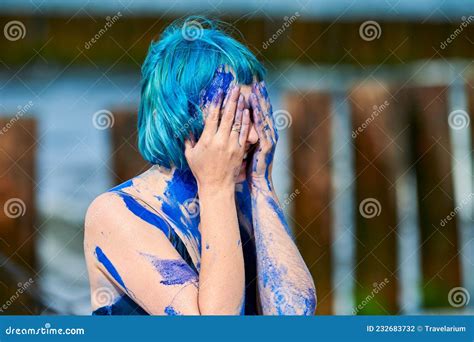 Artistic Blue Haired Woman Performance Artist In Dress Smeared With Blue Gouache Paints On Her